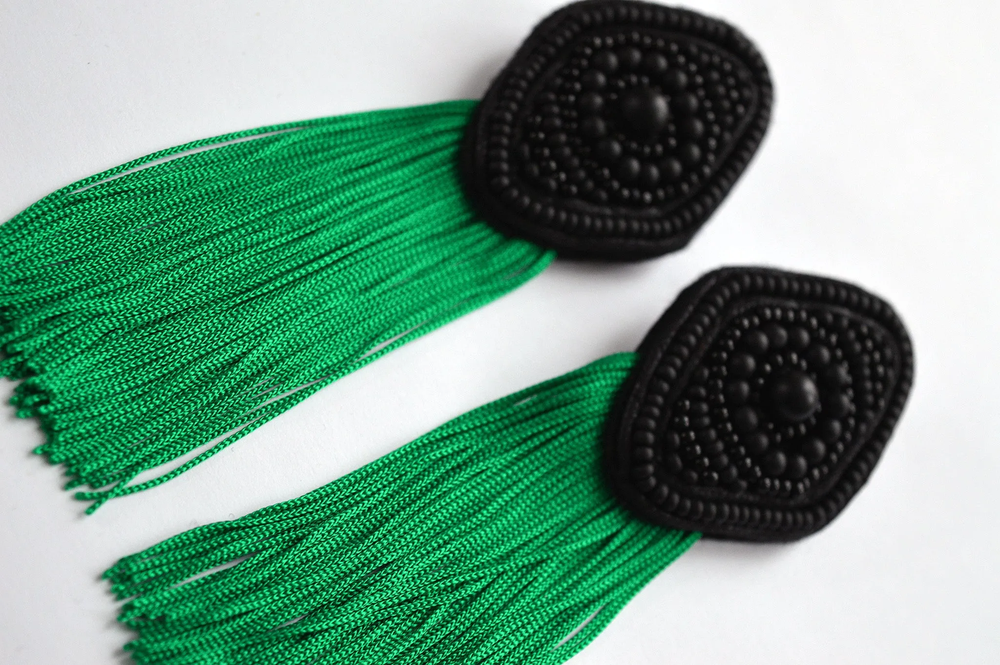 Black rhombus earrings with green fringe
